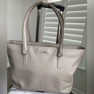 Tumi , gray leather tote with laptop sleeve